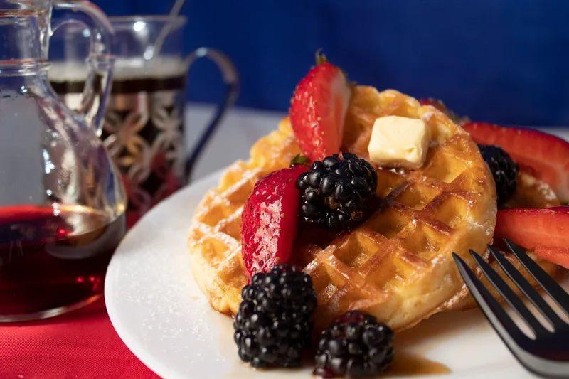 Belgian waffle with fresh berries and whipped cream at Pier 69 Market