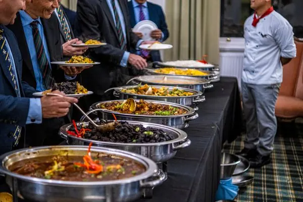 Formal buffet line with chafing dishes at a catered event