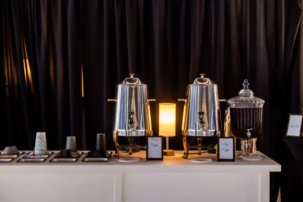 Premium coffee urn service setup with elegant chrome dispensers