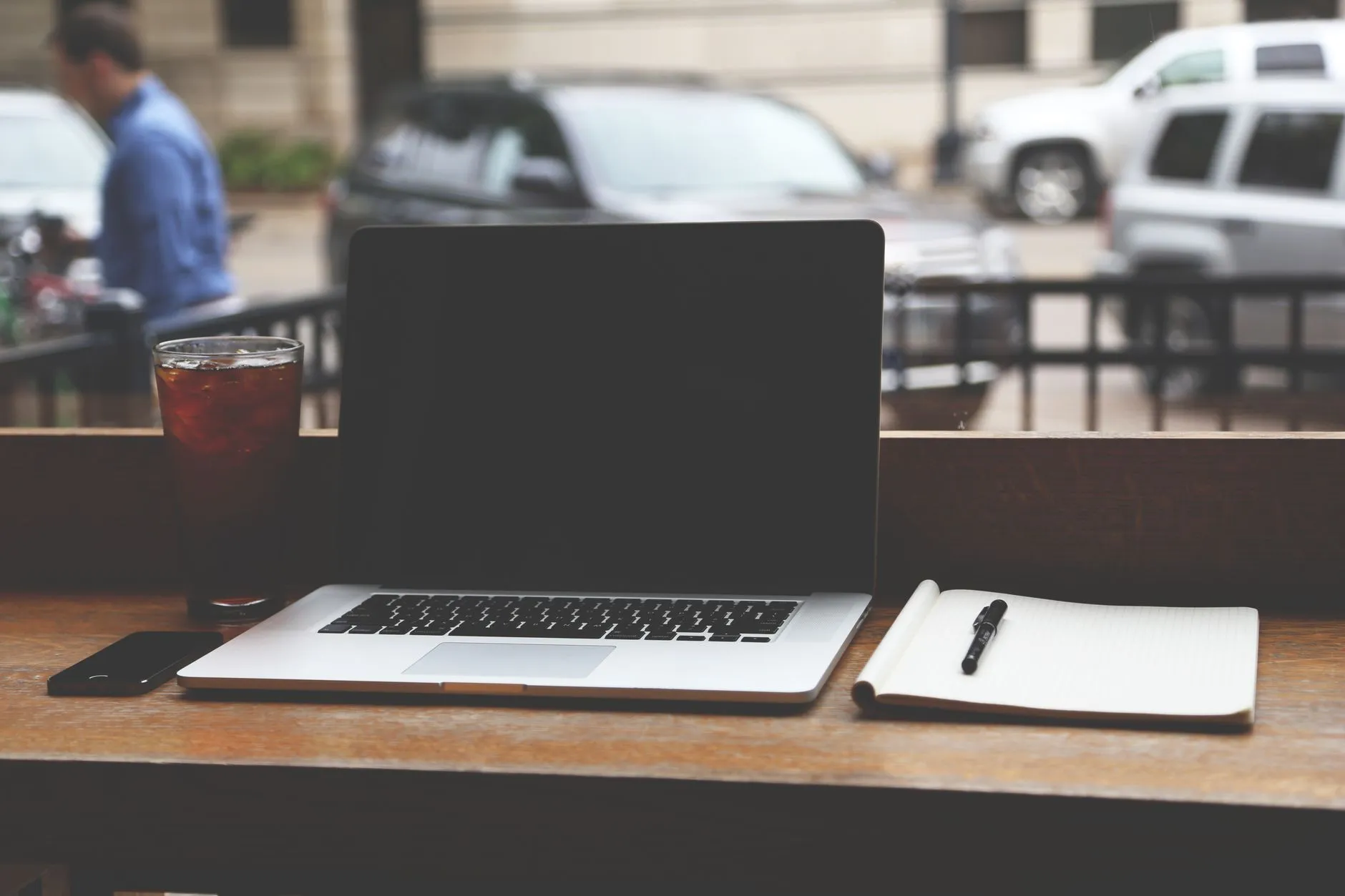 Laptop and coffee at a cafe table in Bay Ridge Brooklyn
