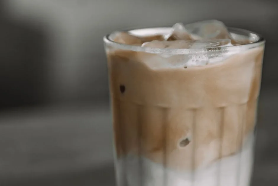 Glass of cold brew coffee with ice cubes on a warm day