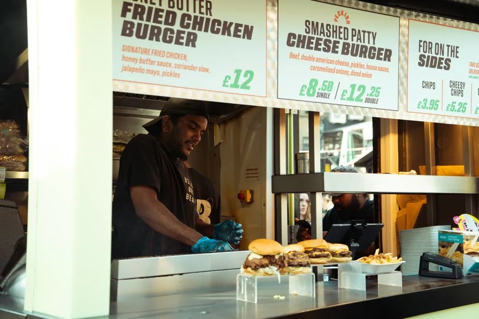 Gourmet smash burger with melted American cheese and special sauce on a toasted brioche bun